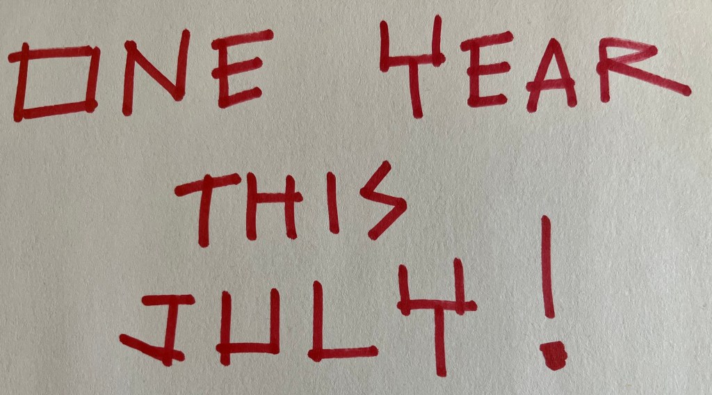 A text in red color and white background says: ONE YEAR THIS JULY!